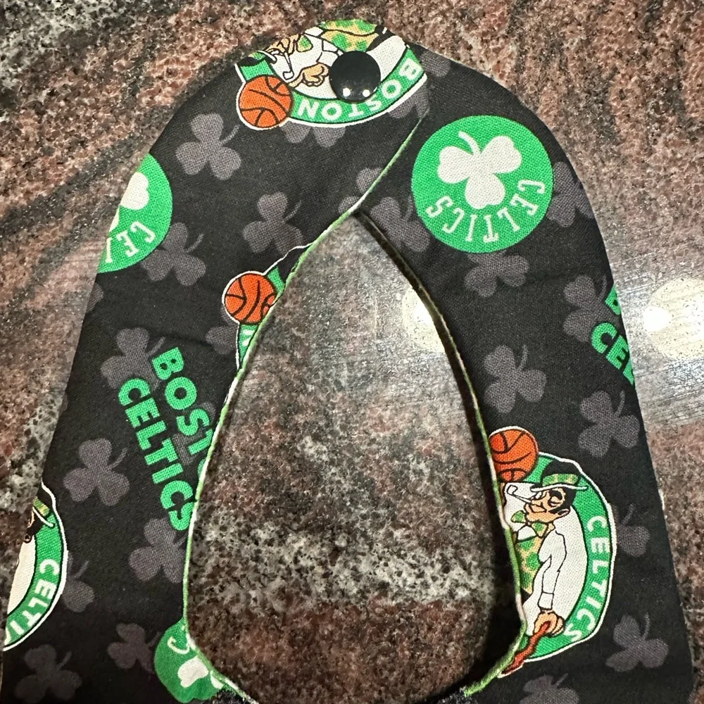 Handmade reversible quilted baby bib in Boston Celtics print